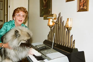 Gloria and dog at keyboard